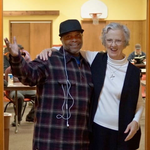 Sister Francella enjoys a moment with a mission patron. Sister Francella enjoys a moment with a mission patron.