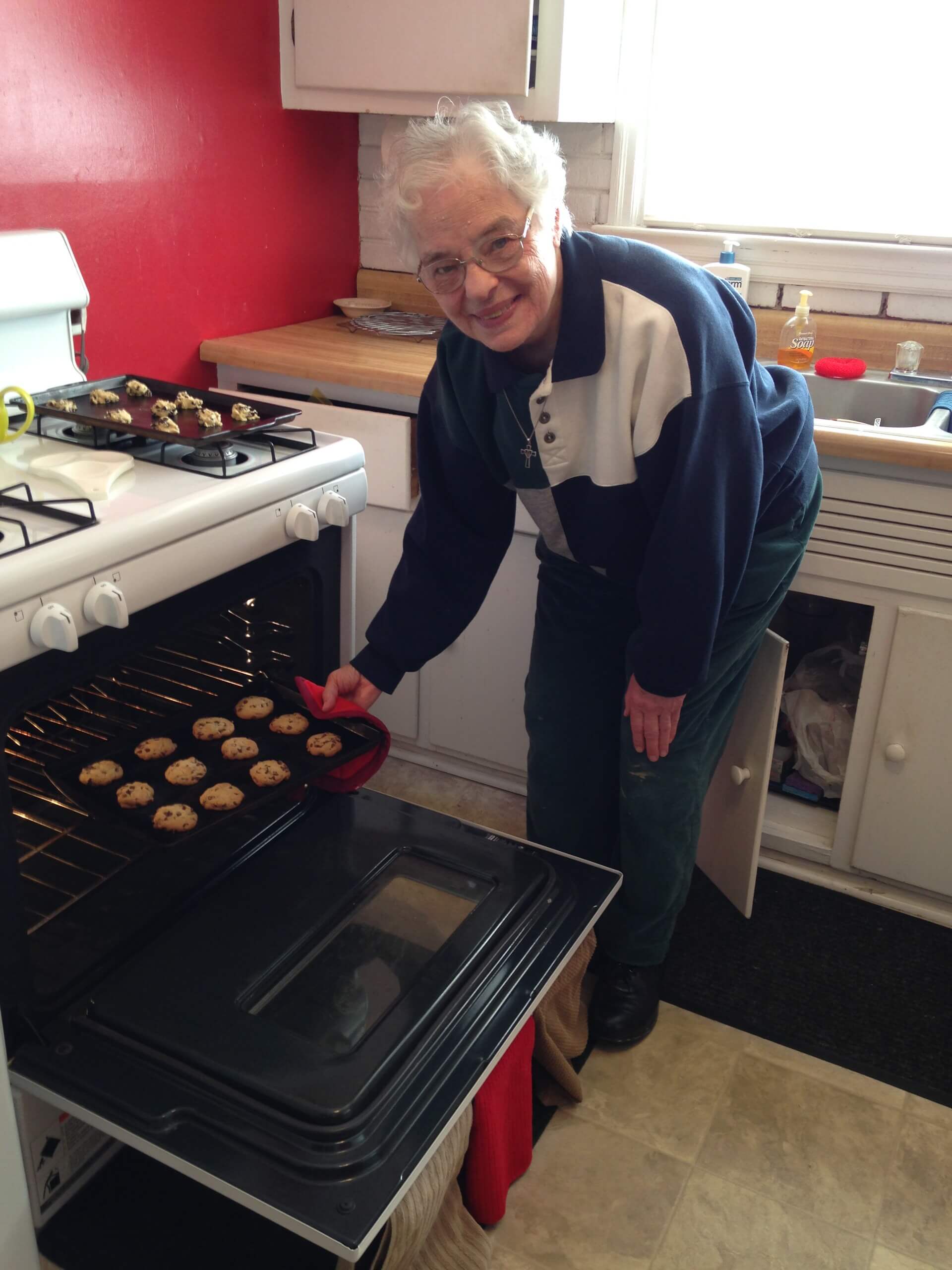 Cookies Sister Georgiana pulling cookies out of the oven
