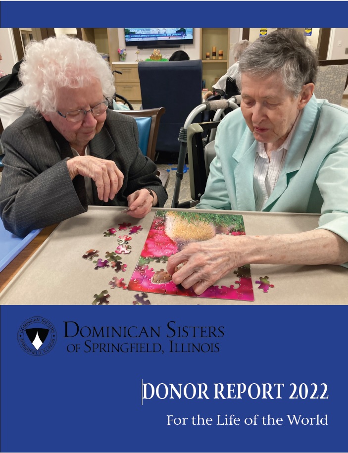 Sister Margaret McCormick, left, and Sister Ancilla Caulfield enjoy a favorite pastime in the Regina Coeli community room.