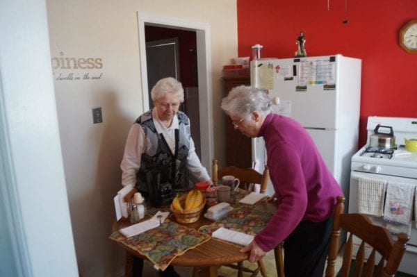 two nuns in kitchen