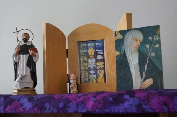 Light-hearted “Dominicana” abounds in the sisters’ tiny convent: St. Dominic, St. Rose of Lima and St. Catherine of Siena accompany a photo of the stained-glass art in the foyer of the motherhouse in Springfield.