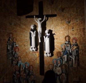 jesus on cross with mural