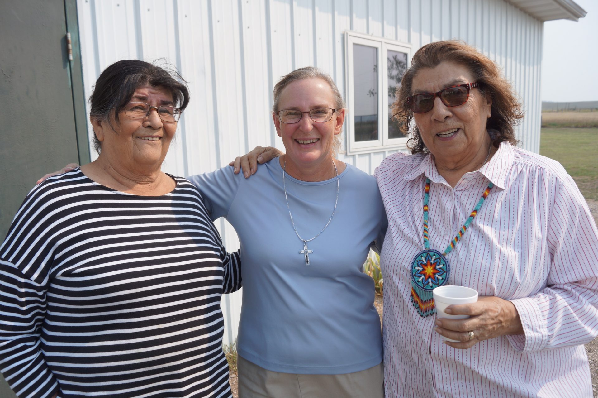 Elizabeth Garnier-Little, right, with her sister Wanda Garnier and Sister Barbara Ann Bogenschutz, OP, at Our Lady of the Sioux Parish, Oglala, S.D., in 2017