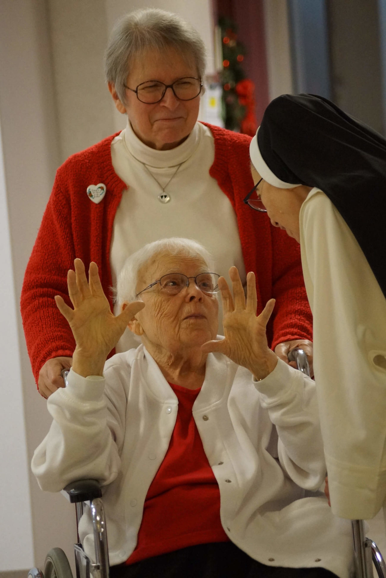 Giving_Tuesday_2019 Sister Loyola Miller and Sister Ann Regina Baker stop for a conversation with Sister Mary Dominic.