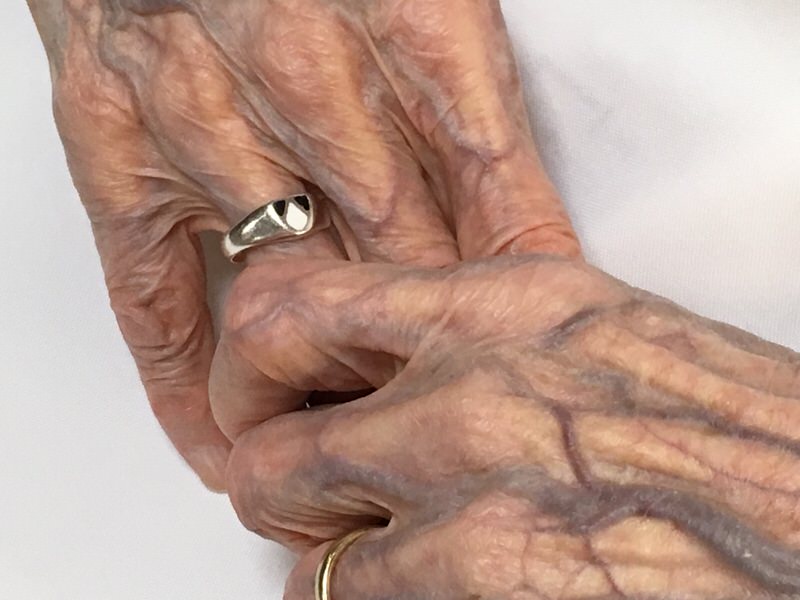 elderly hands clasping