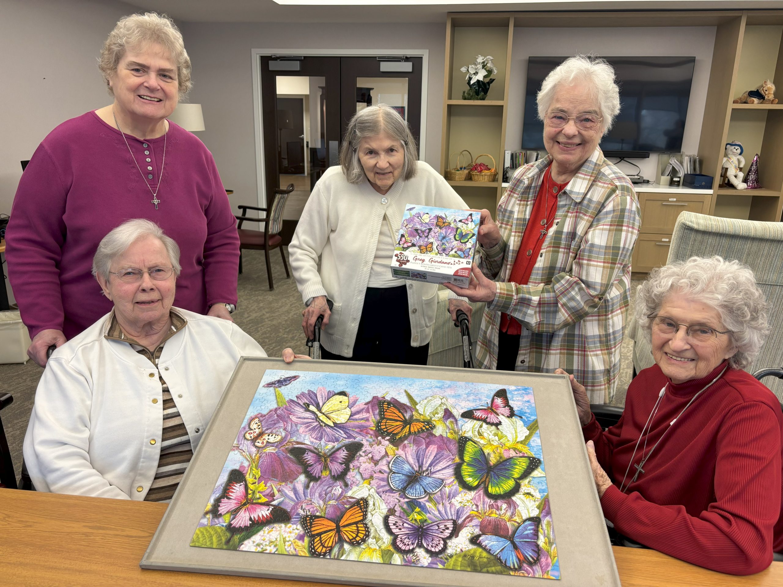 IMG_6183 Sisters Helen Becker, Catherine Mary Currie, Ann Lawrence Buchmiller, Georgiana Stubner, and Anita Tapocik show off their butterfly puzzle.