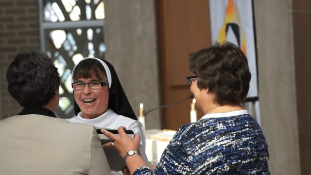 Sister Kelly proclaiming her vows.