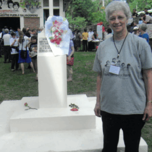 Sister Marcelline Koch, OP, at the grave marker for the martyred  churchwomen, in 2010.