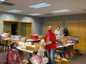 volunteers packing food 
