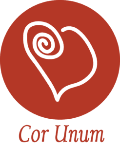 white outline of heart inside red circle - logo for Cor Unum House