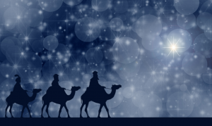 three wise men on camels looking towards shining star in sky