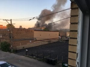 image of building on fire during looting