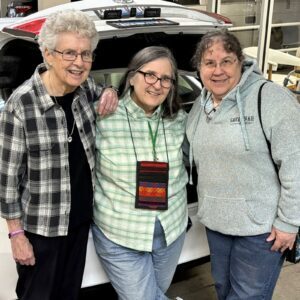 Sisters Judith Hilbing, Adele Human, and Anita Cleary posing together before their spirng 2025 trip to Peru.