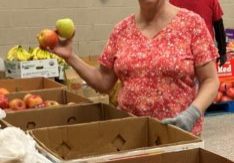 Sister Katrina Lamkin organizes the produce area at the Aurora Area Interfaith Food Pantry. Photo submitted.