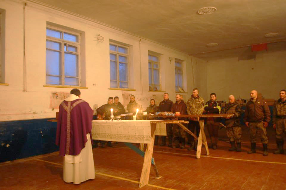 preacher leading service for armed service men/women in Ukraine