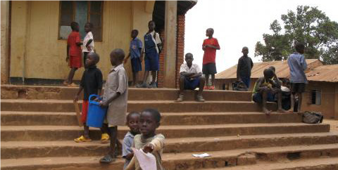 children playing on church steps in Uganda